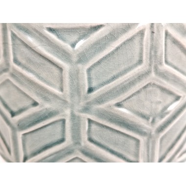 Macetero cerámico verde turquesa con dibujo geométrico en relieve.