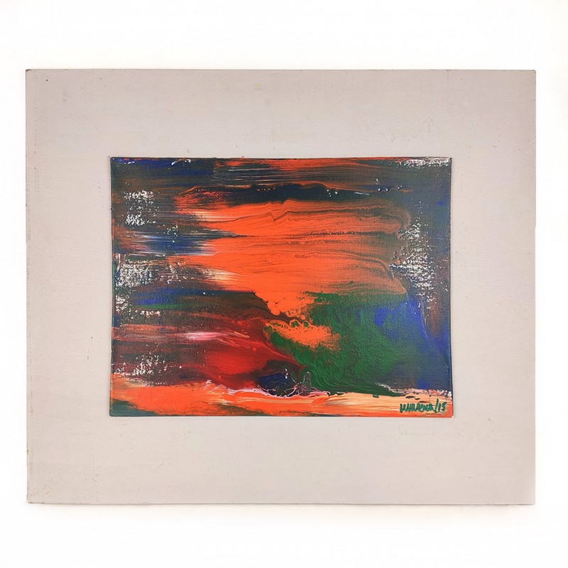 Pintura abstracta multicolor donde predomina el naranja